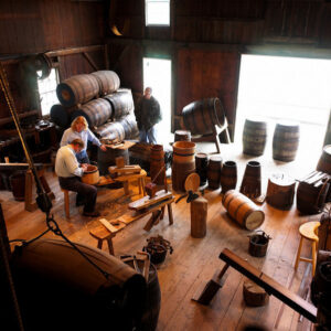 man working inside the cooperage at mystic seaport museum