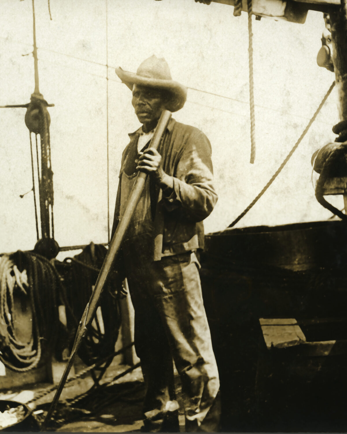 This whaleman, shown onboard an unknown vessel, has been identified by family members as Charles W. Morgan crewmember Joe Gomez, a Cape Verdean-born man who later settled in New London, CT. ©Mystic Seaport Museum, 2009.22.84