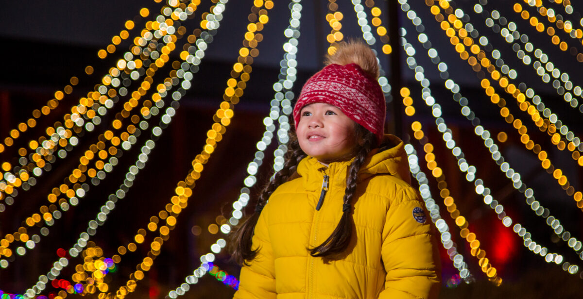 Child enjoying festive lighting